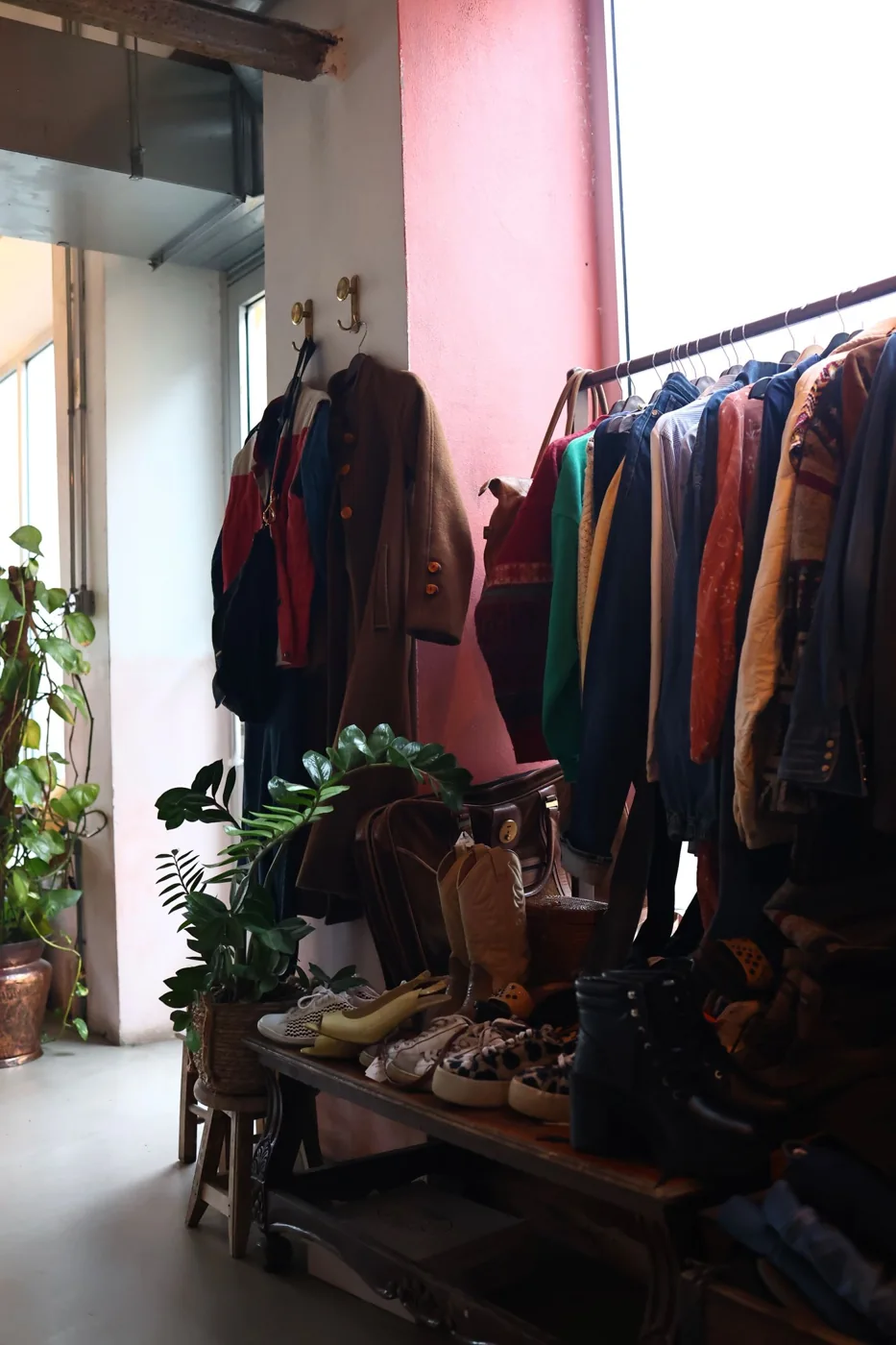 Coats and jackets displayed inside a vintage clothing shop